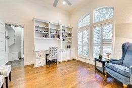 Shared Bedroom 1 — bright room with hardwood floors and shelving