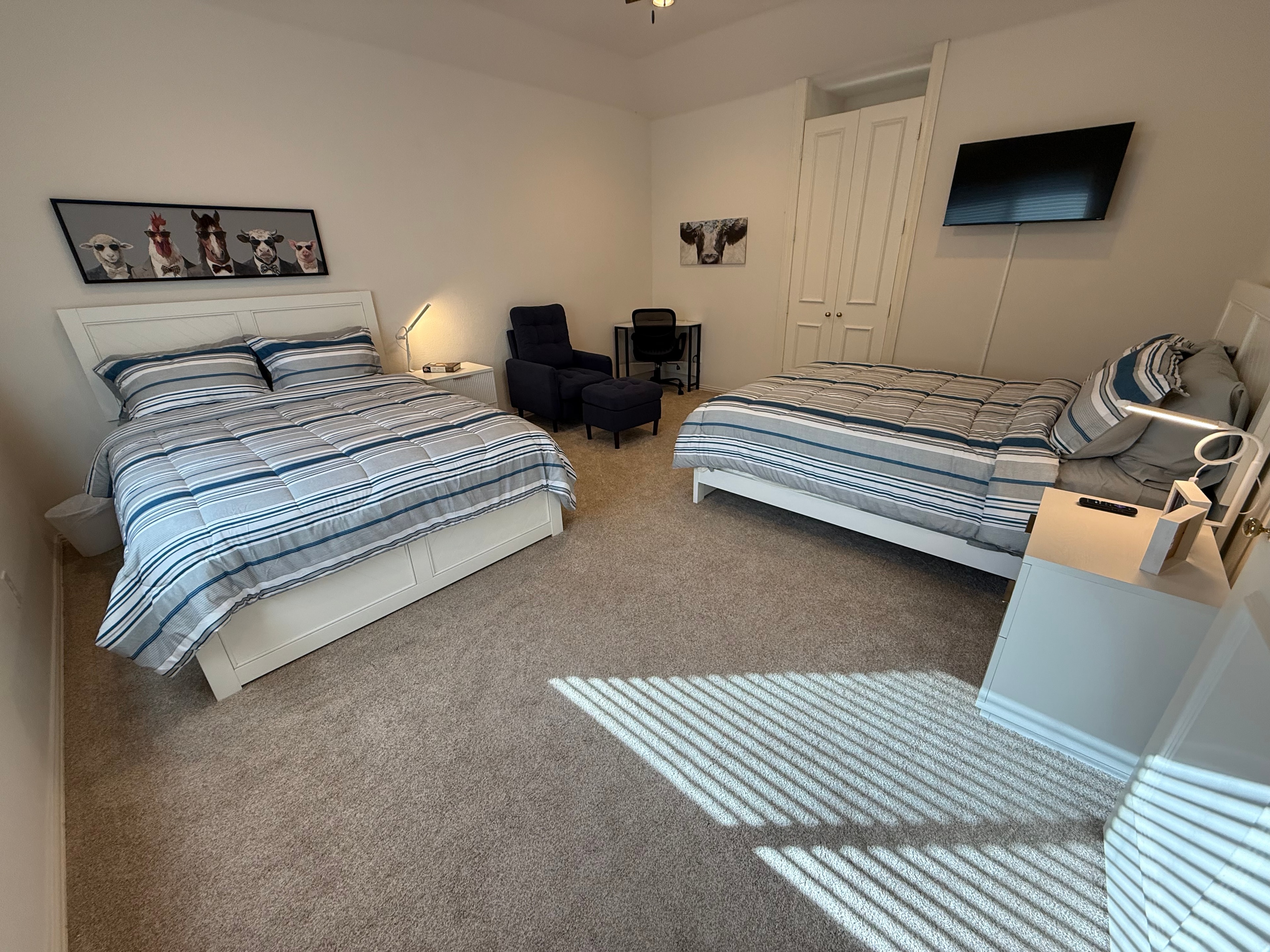 Shared Bedroom 5 — room view from doorway showing carpet and natural light