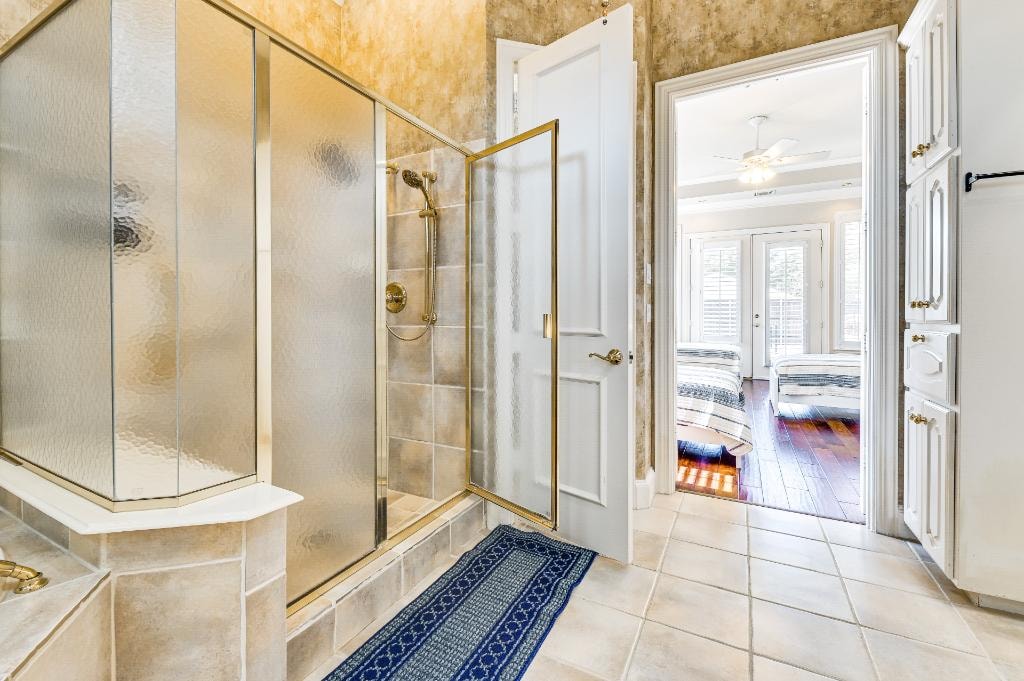 Private Suite Bedroom 2 — adjacent powder room with gold fixtures