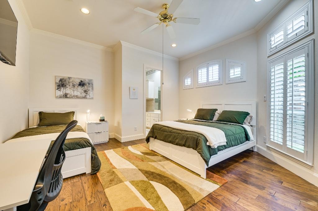 Premier Suite Bedroom 3 — room with two beds and plantation shutters