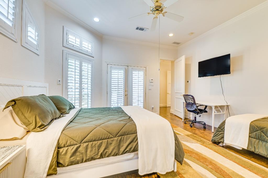Premier Suite Bedroom 3 — queen bed with French doors to private patio